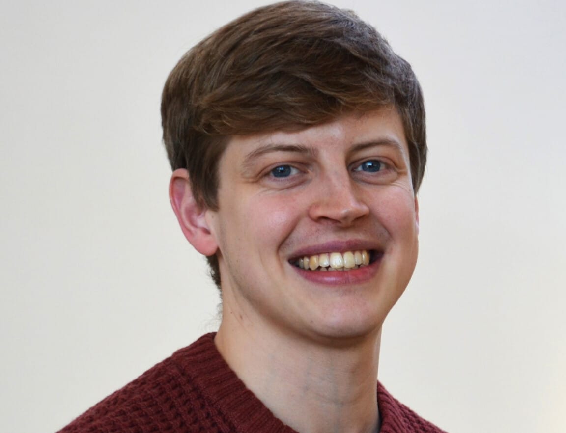 Professional headshot photo of Dr Sam Rowe