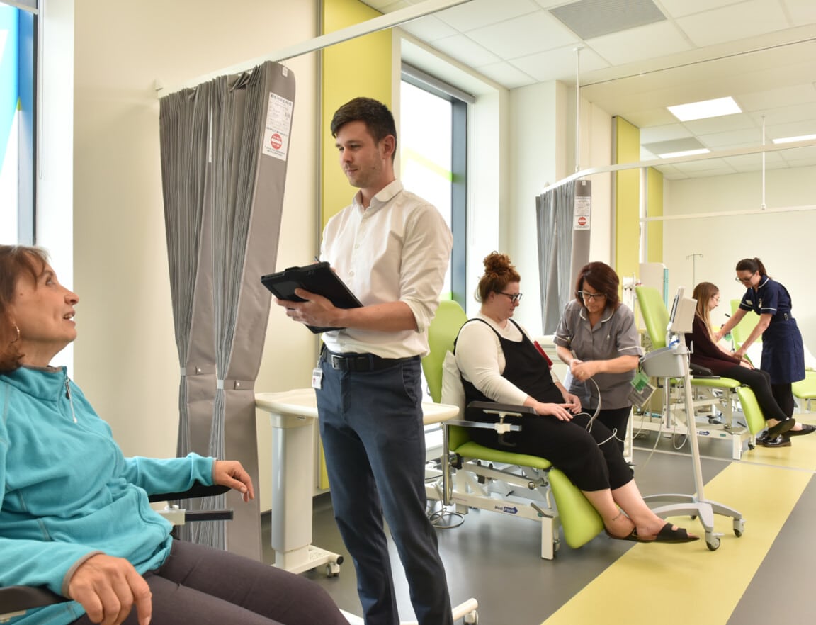 Small groups of people interacting in the Clinical Research Facility