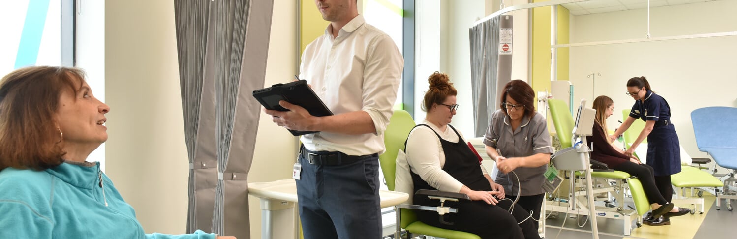 Small groups of people interacting in the Clinical Research Facility