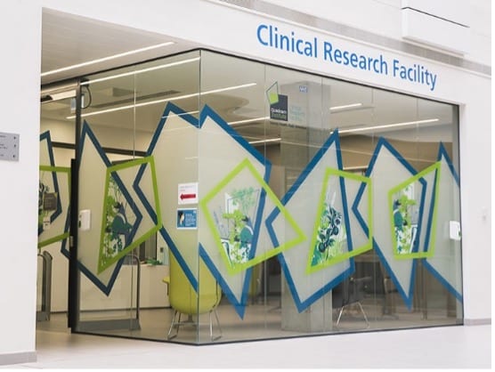 Outer glass walls and graphics of the Clinical Research Facility