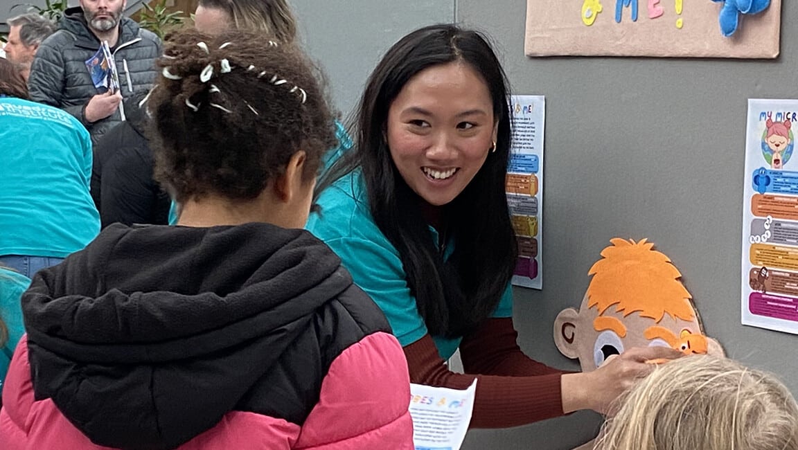A group of researchers using hands-on activities to interact with the public at Norwich Science Festival