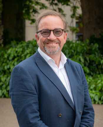 Professional headshot photo of Professor Philip Baker