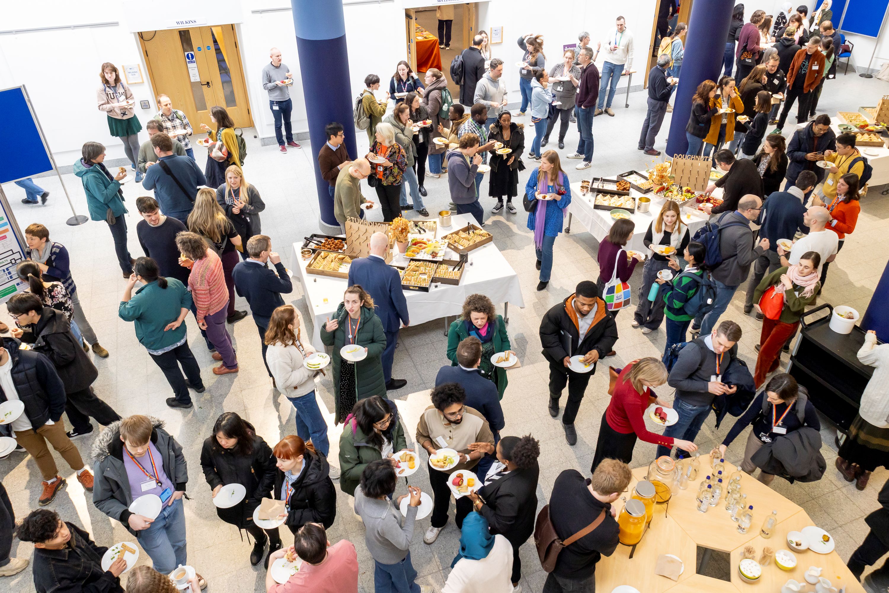 Conference attendees networking over food and drinks