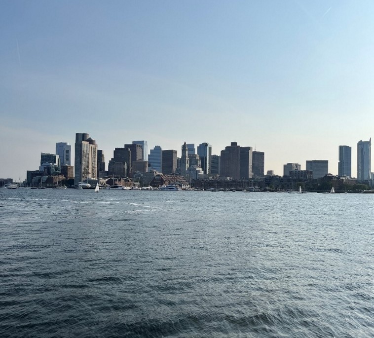 View of tall city buildings seen across a body of water