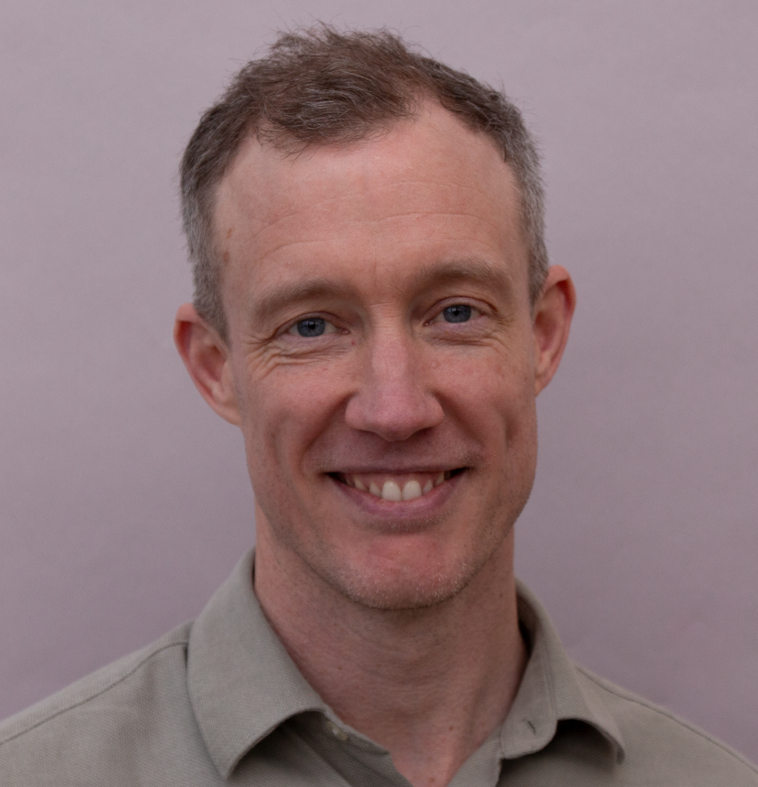 Professional headshot photo of Dr Mark McMullan